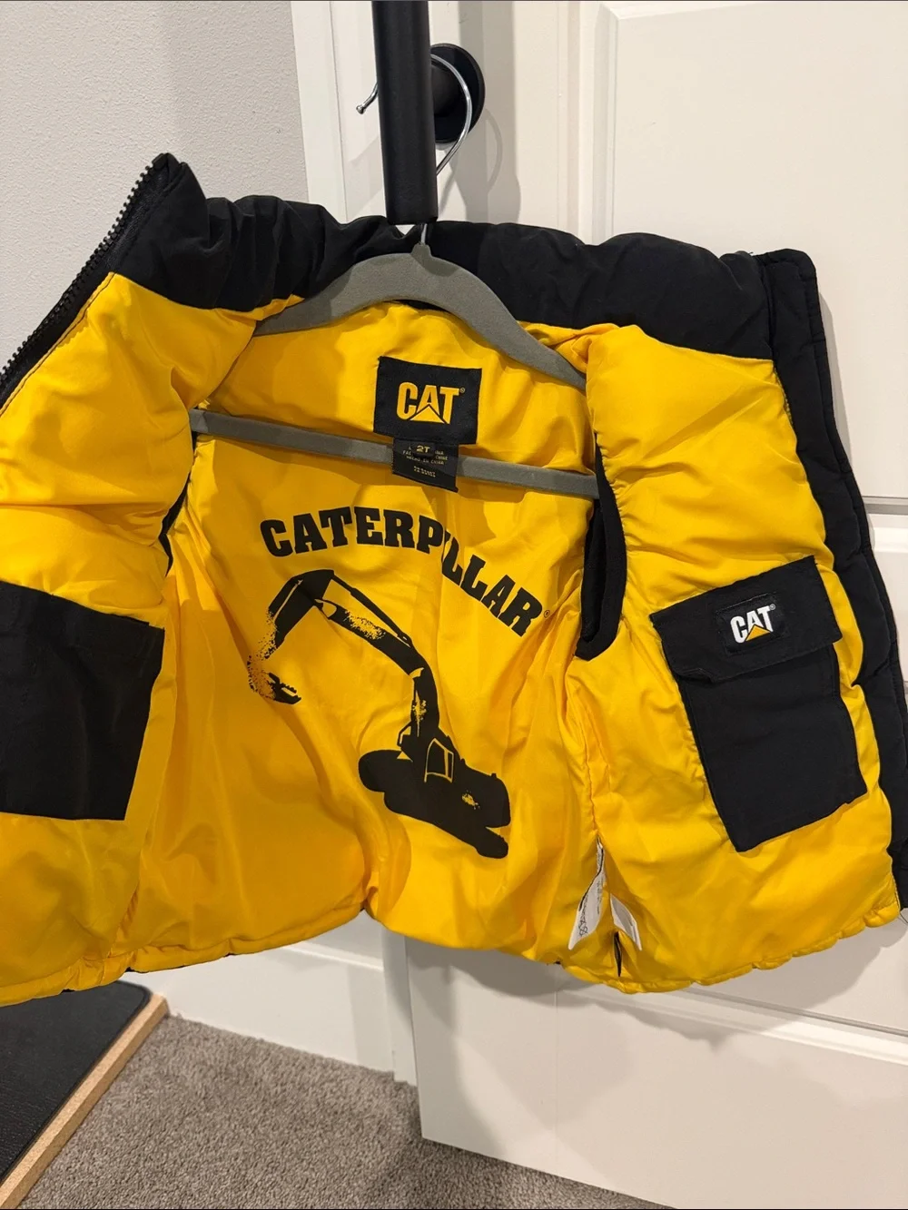 Caterpillar Black Puffer Kids Vest with Yellow Logo